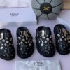 TOGA VIRILIS EYELET METAL BLACK LEATHER SABOT CLOGS